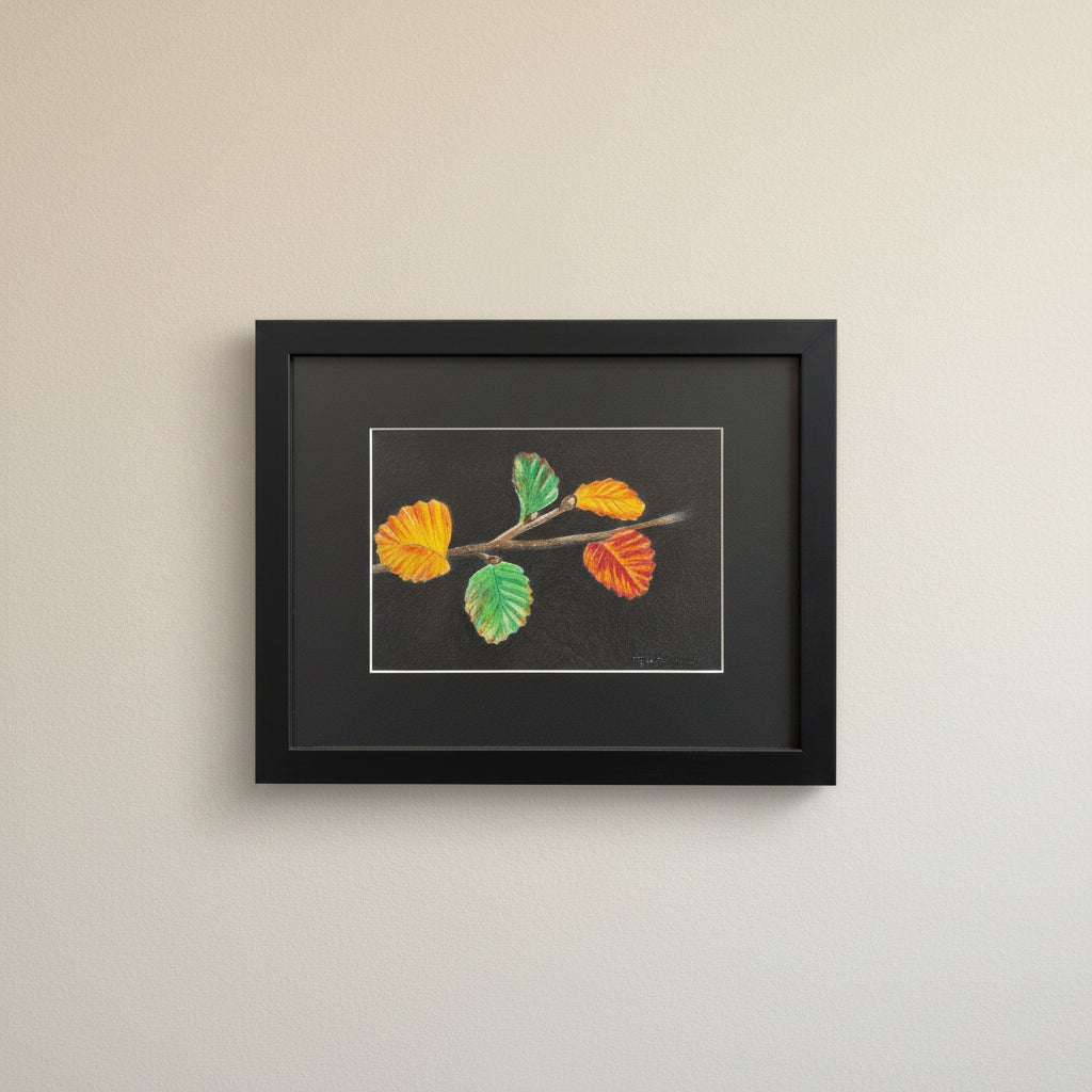 framed artwork of fagus leaves in orange green and red framed in black
